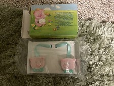 IN BOX, 1992 AVON PIGGY PATROL MUSICAL BIB HOLDER