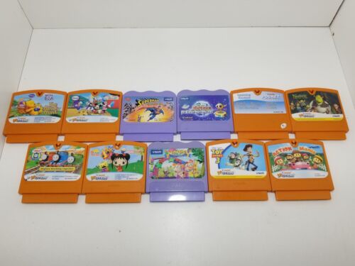Eleven VTech Smile and Motion Game Cartridges - Superman, Tinkerbell, Toy Story+