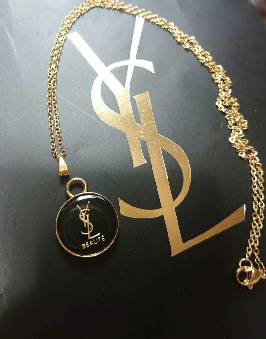 Collana Yves Saint Laurent logo YSL BEAUTE rotonda oro misura catena 50 cm con scatola