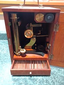 Antique J. Hicks brass microscope with slides,lenses and wooden case