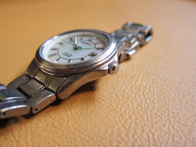 SEIKO V145-0AZ0 Solar Titanium Men's Watch with Shell Dial