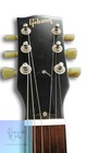 Black Gibson USA SG SPECIAL fretboard with gold hardware, six strings, and “Gibson USA” logo on head.