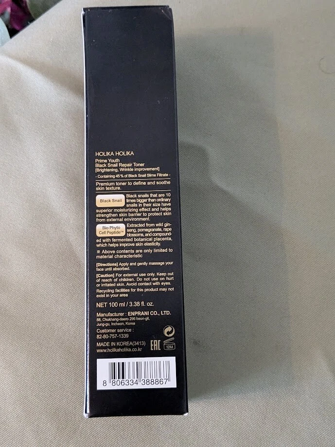 Tónico reparador de caracoles negros Holika Holika 3,38 fl oz - líquido hidratante para rostro  Foto 2 de 4