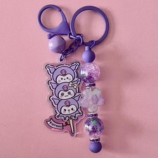 kuromi keychain with bell and spinning charms sanrio