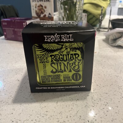 BOX 12 SETS Ernie Ball Electric Guitar Strings Regular Slinky 10-46 Nickel Wound