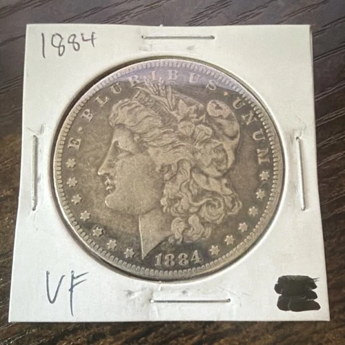 1884 Morgan Dollar $1 VF Silver Coin Circulated Uncertified US Collectible