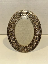 1928 brand mini gold oval photo picture frame.