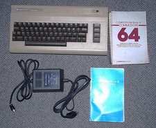 Commodore 64 Computer w/Power Supply, Users Manual,  64 First Book. Powers on.