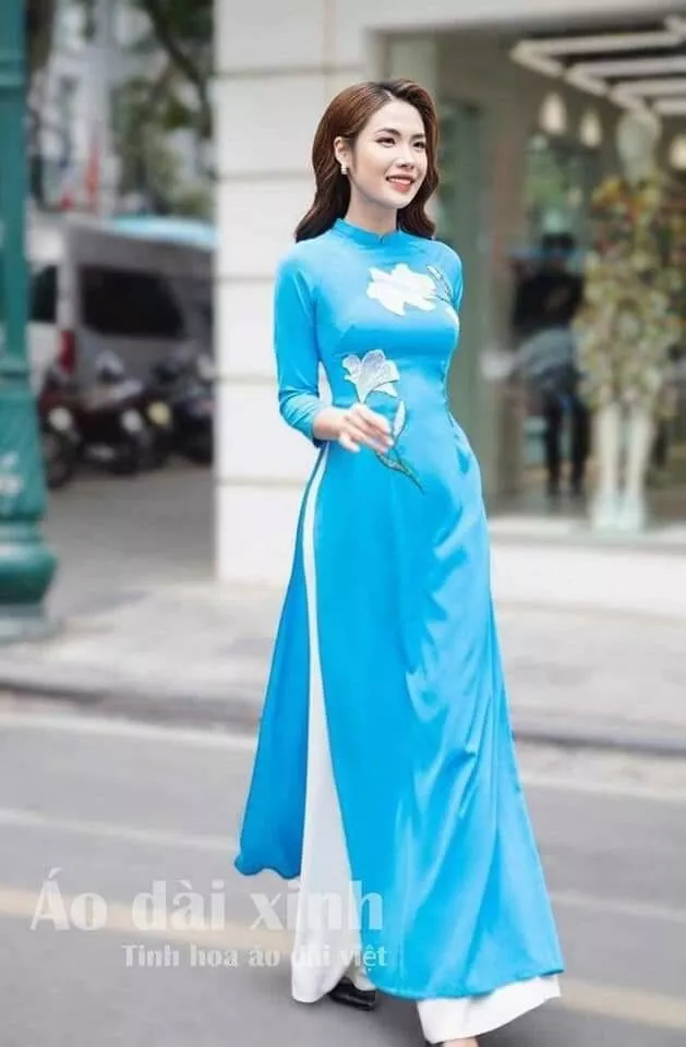 Designed Blue Vietnamese Traditional Ao Dai for women.