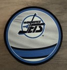 Connor Hellebuyck Autographed Winnipeg Jets Reverse Retro Hockey Puck  — photo 2