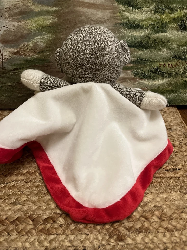 Baby Starters Calcetín Mono Lovey Manta de Seguridad 12” Sonajero Satinado Blanco Rojo Foto 4 de 4