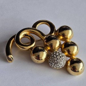 Authentic Courrèges vintage brooch features a dimensional fruit motif with gold-plated bra