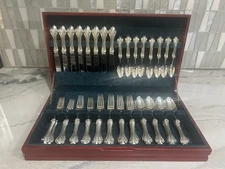 40 piece Valpeltro Fior d Alise pewter table ware.