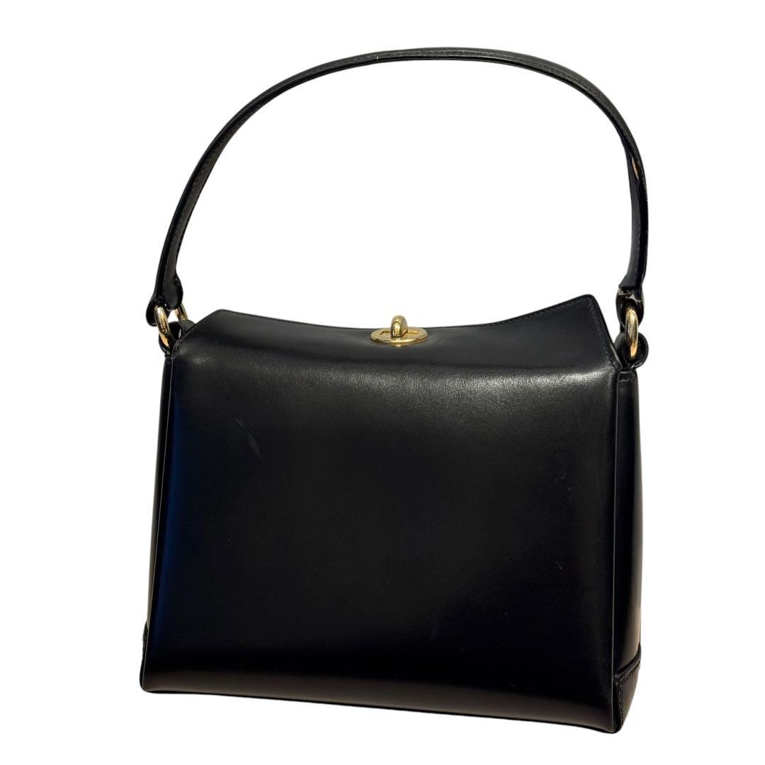 Vintage Gucci Black Leather Handbag with Turn Lock - Pre-Owned Formal Bag