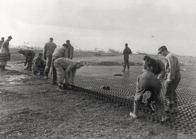 Soldiers cover ground steel mats make passage fighter planes easie- Old Photo