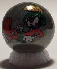 Marvin the Martian Laying 1" Gray Glass Logo Marble w/ Stand