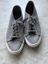 Superga Gray Canvas Low-Top Sneakers. Rubber white sole. Silver tone eyelets.