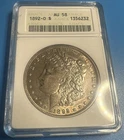 1892-O Morgan Silver Dollar AU58 ANACS Soapbox (M6233)