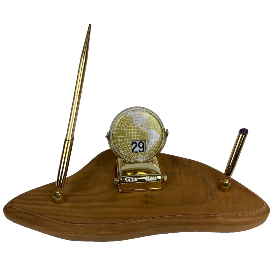 A wood mid-century perpetual calendar globe with pen/pencil holder — perpetual calendars are timeless desk objects that double as sculpture.