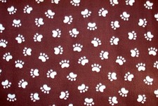 BTY TAN DOG OR CAT PAW PRINTS ON BROWN BACKGROUND FLEECE FABRIC 1 YD 60 x36"