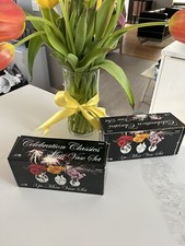 two sets of three mini vases each