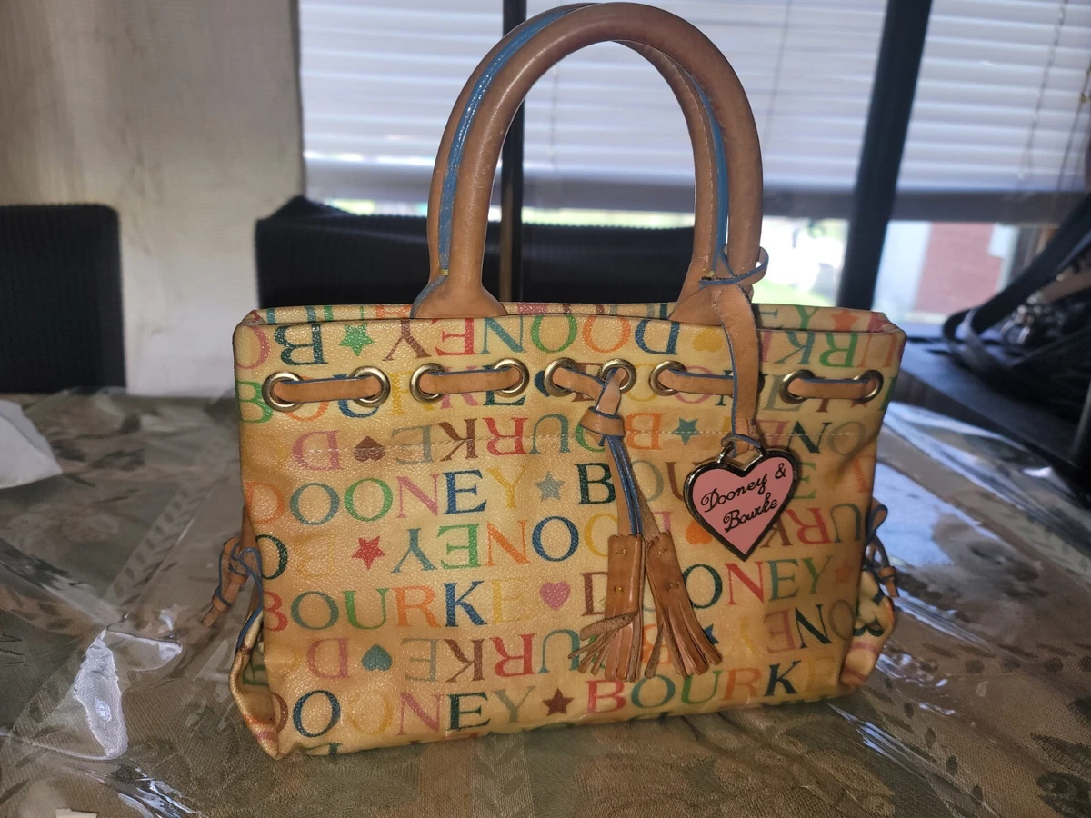 Dooney and bourke store it bag discoloration