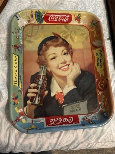 Vintage Coca-Cola lithographed metal serving tray with a 1950s woman.