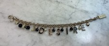DOLCE GABBANA Gold Tone Desire Charm Bracelet...