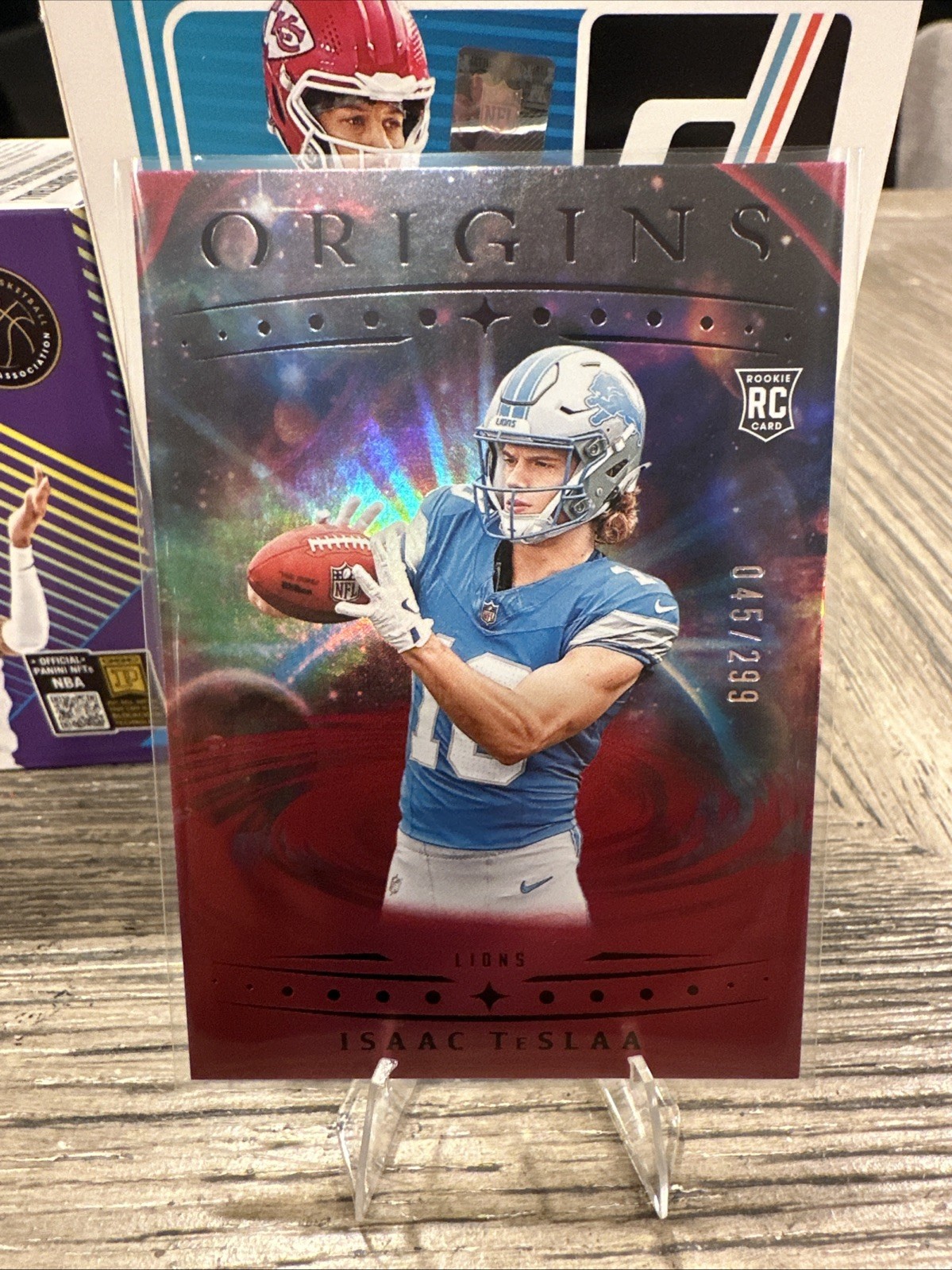 2025 Panini Origins - Rookies Isaac Teslaa, Isaac Teslaa #118 Holo Red /299 (RC)