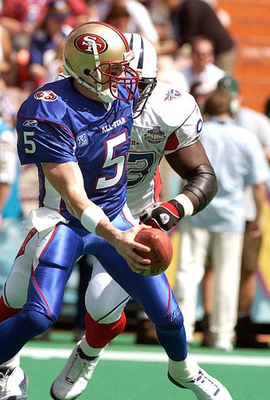 #ad Jeff Garcia NFC scrambles away from the pressure of Kevin Carter A Old Photo 1 AU $9.00