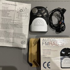 GPX R116B portable AM/FM radio with wired headphones.