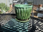 vintage McCoy pottery planter featuring a green drip glaze and a bamboo-style