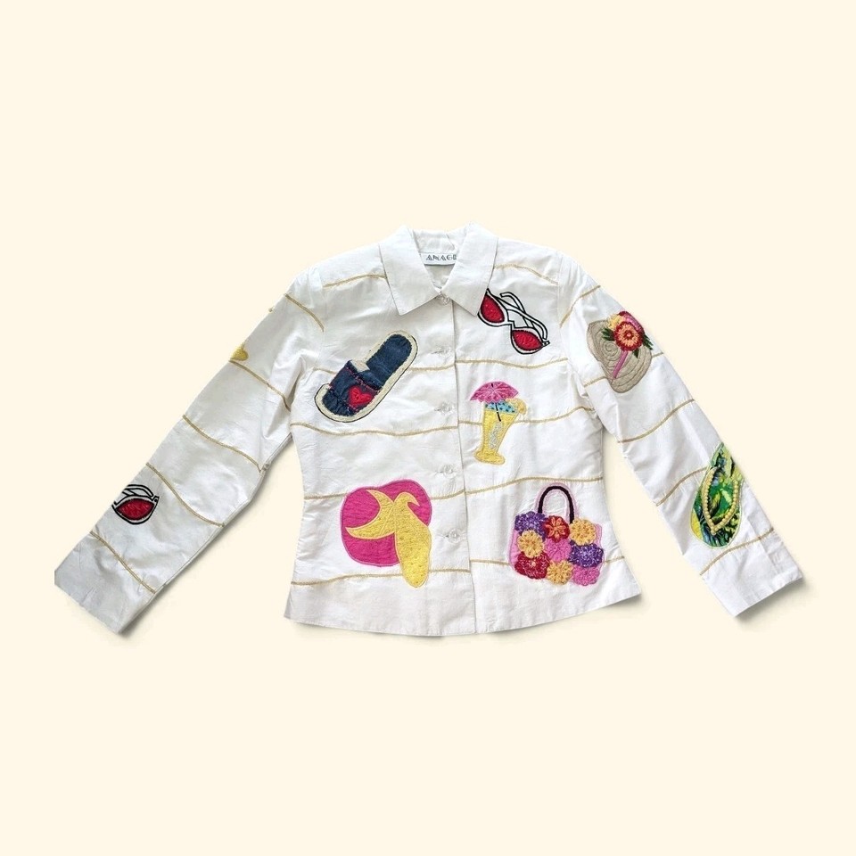 A beaded and sequined silk statement jacket that looks like it escaped from a glamorous 80s resort — wearable art for someone who dresses to be remembered.