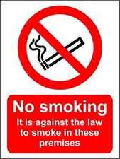 Image of No smoking it is against the law to smoke in these premises sign