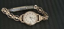 VINTAGE LADIES 9CT GOLD CASED MECHANICAL "TISSOT " WATCH. ROLLED GOLD CHAIN.
