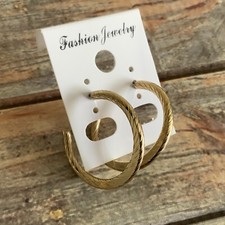 Vintage pierced gold tone flattened textured twist hoop earrings