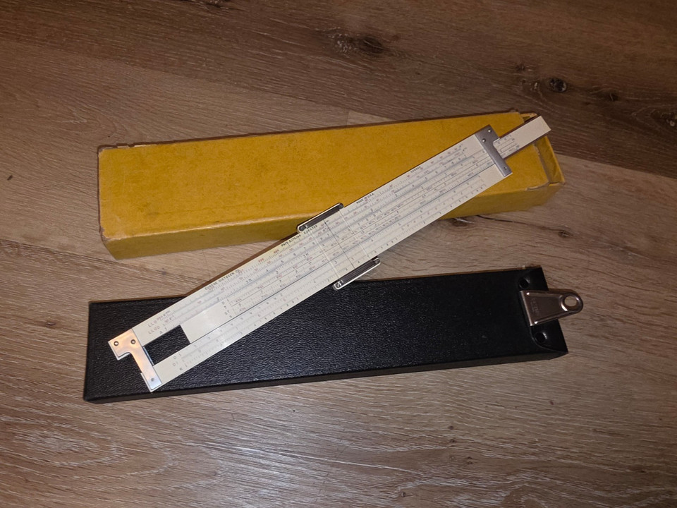 A Dietzgen Maniphase Multiplex slide rule with Log Log and Trig scales — a beautifully complex analog calculating instrument that looks like a prop from a 1950s sci-fi lab.