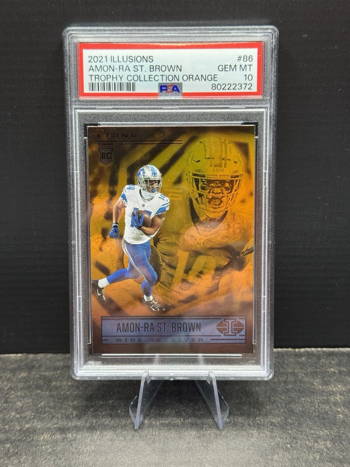Amon-Ra St. Brown Panini Illusions #86 Trophy Collection Orange