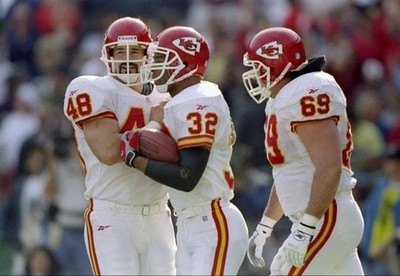 Running back Marcus Allen Kansas City Chiefs is congratulated by t- Old Photo
