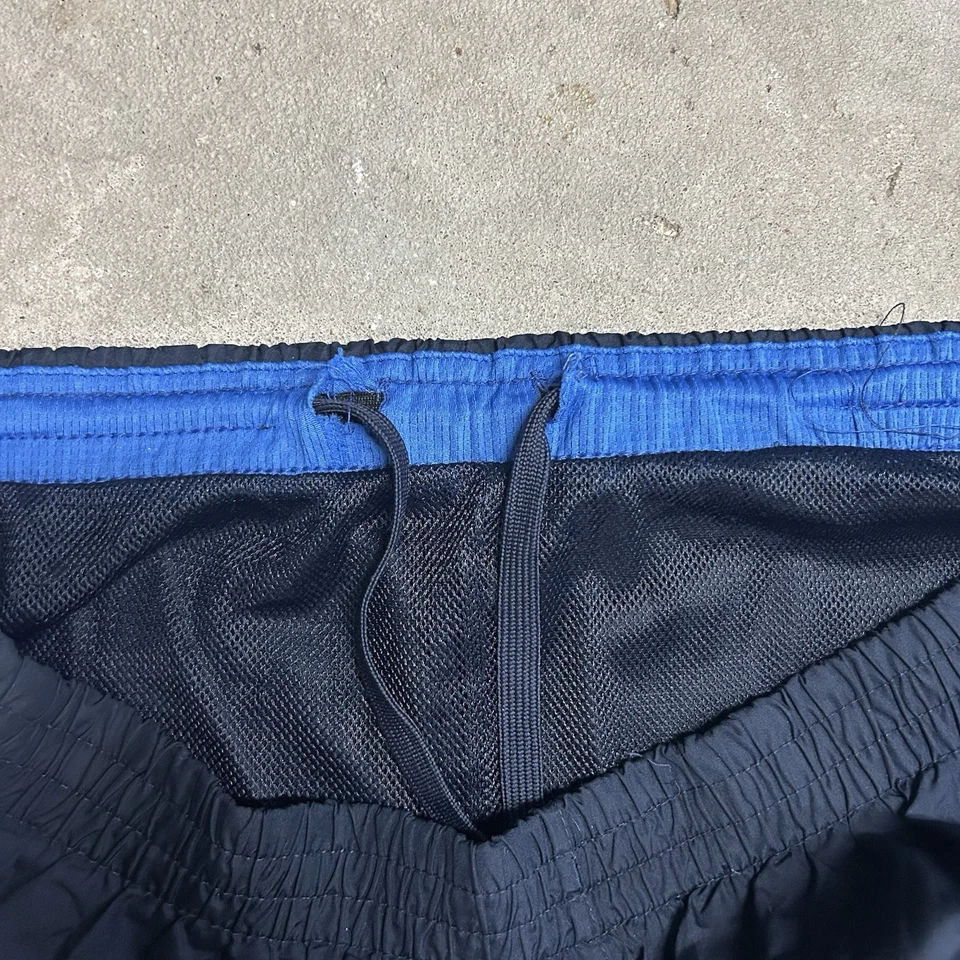 Pantalones deportivos cortavientos vintage Starter para hombre forrados en malla L pierna ancha azul Foto 4 de 4