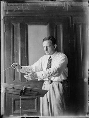 Professor Bernard Heinze conducting from a rostrum at Australia Ha- Old Photo