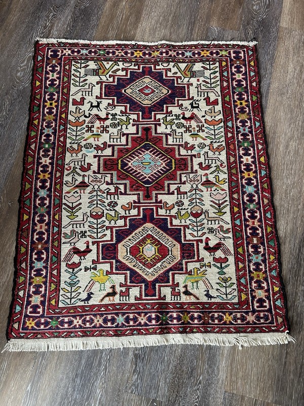 Wool and cotton tribal rug w/geometric medallion design from the Caucasus region