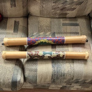 Pair of Bamboo Didgeridoos with Aboriginal Dot Art and Animal Motifs.