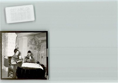 40064132 - 2251 Pellworm women in costumes eat an ice cream costume Germany