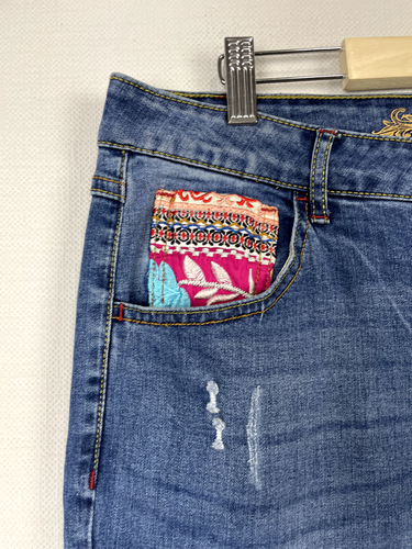 Jeans elásticos con bolsillo multicolor bordados azules Desigual talla 34 - Imagen 6 de 19