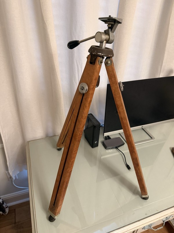 vintage wooden camera or movie tripod