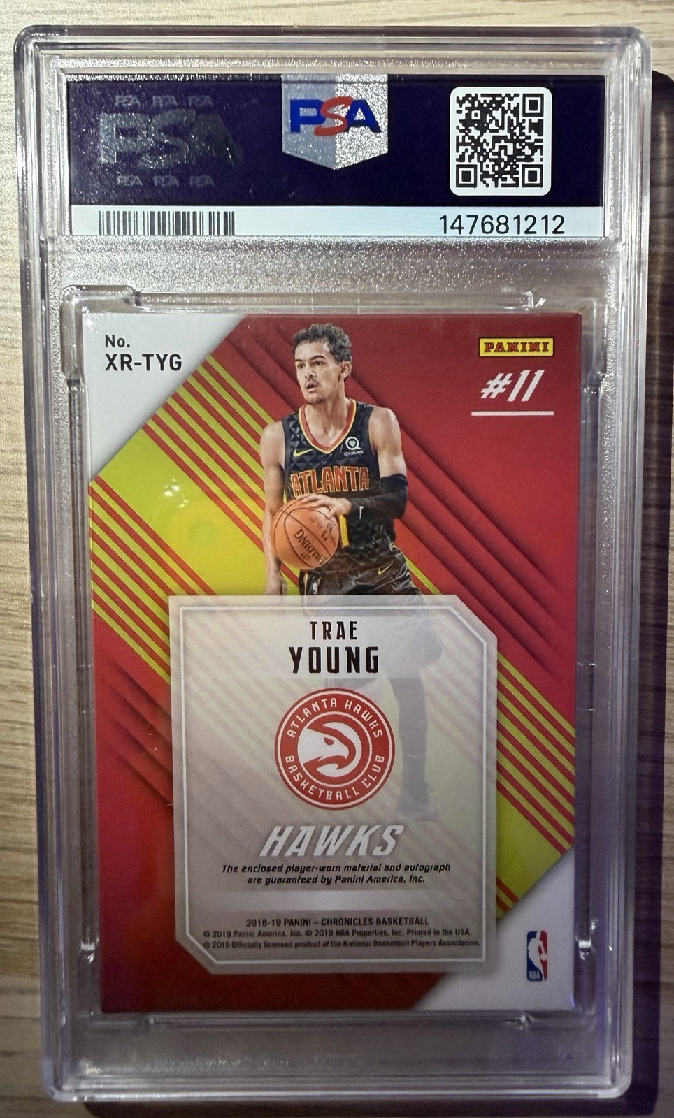 2018-19 Panini Chronicles Trae Young XR Rookie Jumbo Swatch Auto /50 PSA 7 view 2