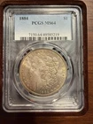 1884 $1 Morgan Silver Dollar PCGS ms64 tond