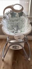 New, never used, Graco brand baby rocking chair, gray, in excellent condition.