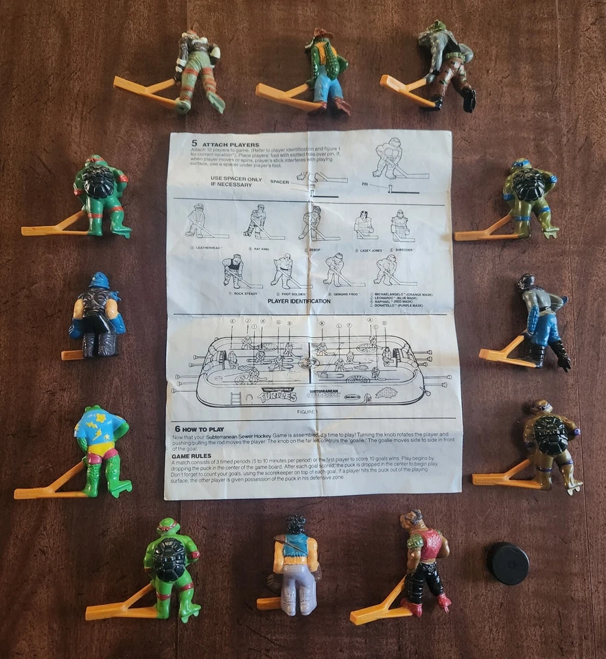 1990 Teenage Mutant Ninja Turtles Subterranean Sewer Hockey 12 chicos, disco, Instr Foto 2 de 4